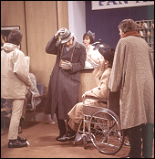 The Beatles arrive at the airport heavily disguised on their way to the Bahamas in a scene from their second feature film, Help! The humor comes in when you discover that it's still completely obvious that they are The Beatles.